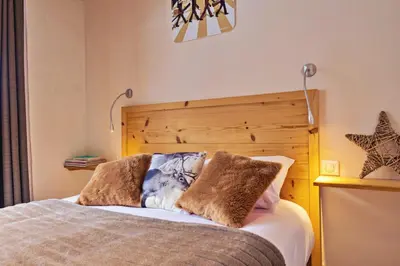 Un ou plusieurs lits dans un hébergement de l'établissement Inversens superbe chalet vue montagne