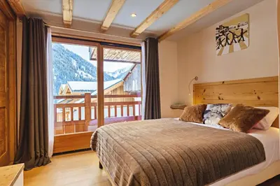 Un ou plusieurs lits dans un hébergement de l'établissement Inversens superbe chalet vue montagne