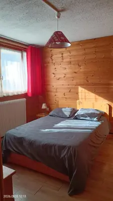 Un ou plusieurs lits dans un hébergement de l'établissement Ambiance Chalet