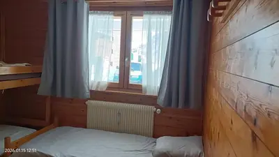 Un ou plusieurs lits dans un hébergement de l'établissement Ambiance Chalet