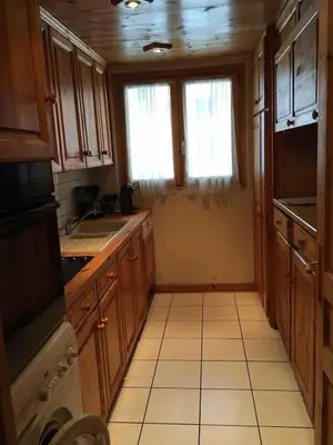 Cuisine ou kitchenette dans l'établissement Ambiance Chalet