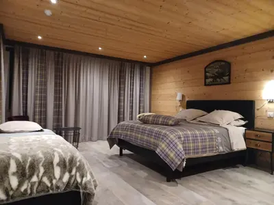 Un ou plusieurs lits dans un hébergement de l'établissement Chalet La Dolce Vita en Savoie