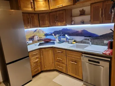 Cuisine ou kitchenette dans l'établissement Chalet de Pramariaz