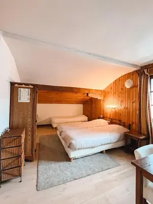 Un ou plusieurs lits dans un hébergement de l'établissement Hotel Le Genepy