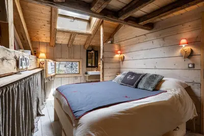 Un ou plusieurs lits dans un hébergement de l'établissement Chalet Mémé dans les Orties