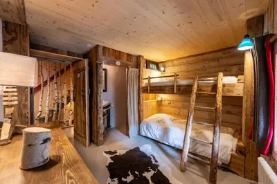 Un ou plusieurs lits dans un hébergement de l'établissement Chalet Mémé dans les Orties
