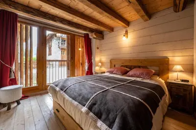 Un ou plusieurs lits dans un hébergement de l'établissement Chalet Mémé dans les Orties