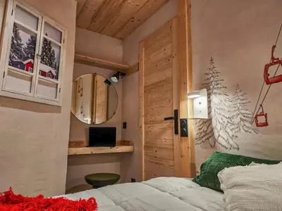 Un ou plusieurs lits dans un hébergement de l'établissement Arc 2000 -location de 2 appartements et 1 studio avec balcon et vue