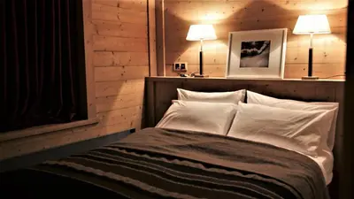 Un ou plusieurs lits dans un hébergement de l'établissement Chalet Geneviève