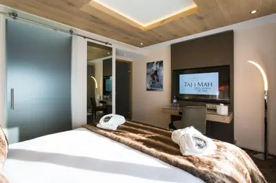 Un ou plusieurs lits dans un hébergement de l'établissement Hôtel Taj-I Mah by Les Etincelles