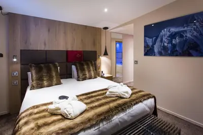 Un ou plusieurs lits dans un hébergement de l'établissement Hôtel Taj-I Mah by Les Etincelles