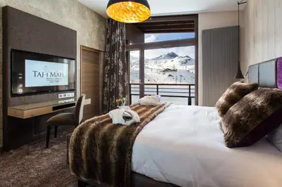 Un ou plusieurs lits dans un hébergement de l'établissement Hôtel Taj-I Mah by Les Etincelles