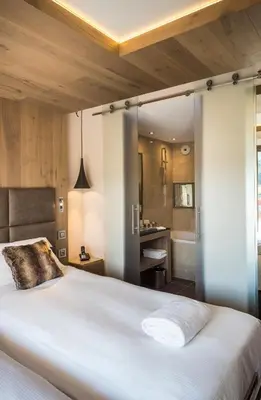 Un ou plusieurs lits dans un hébergement de l'établissement Hôtel Taj-I Mah by Les Etincelles