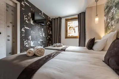 Un ou plusieurs lits dans un hébergement de l'établissement Chalet Skadi - Village Montana