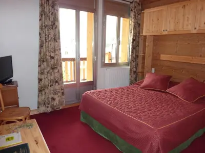 Un ou plusieurs lits dans un hébergement de l'établissement Hôtel Le Grand-Bec