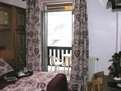 Un ou plusieurs lits dans un hébergement de l'établissement Hôtel Le Grand-Bec
