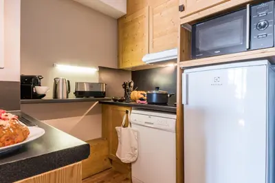 Cuisine ou kitchenette dans l'établissement Résidence Pierre & Vacances Les Balcons De Bellevarde