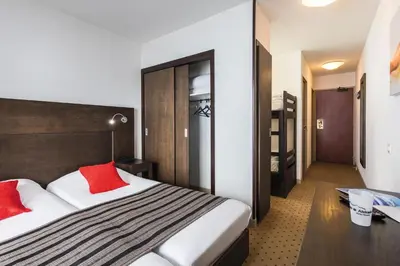 Un ou plusieurs lits dans un hébergement de l'établissement Hôtel Tignes Le Diva