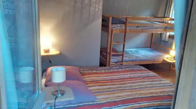 Un ou plusieurs lits dans un hébergement de l'établissement Chalet les marmottes