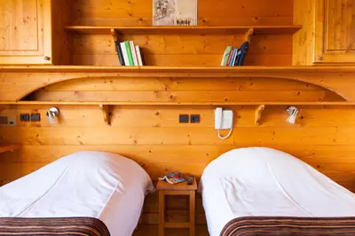Un ou plusieurs lits dans un hébergement de l'établissement Hôtel La Vanoise