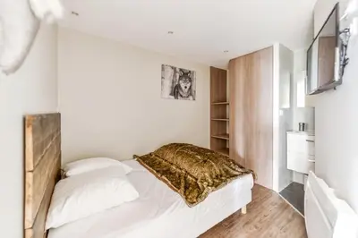 Un ou plusieurs lits dans un hébergement de l'établissement Résidences quartier Charmettoger - maeva Home