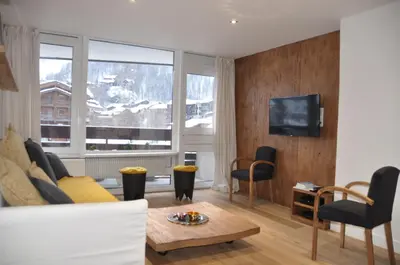 Coin salon dans l'établissement Les Cîmes - Cosy apartment