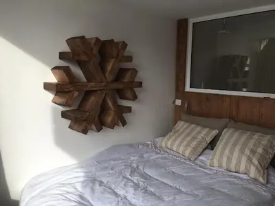 Un ou plusieurs lits dans un hébergement de l'établissement Les Cîmes - Cosy apartment