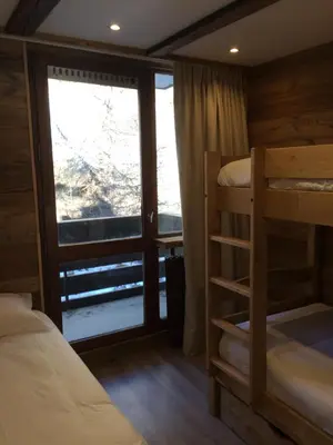 Un ou plusieurs lits dans un hébergement de l'établissement Appartement vue 180° sur massif