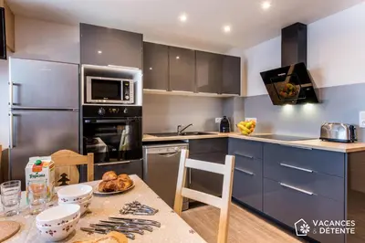 Cuisine ou kitchenette dans l'établissement Tignes 301