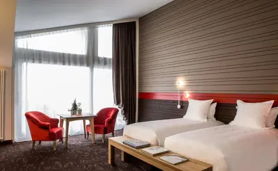 Un ou plusieurs lits dans un hébergement de l'établissement Hotel Ormelune