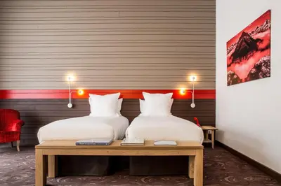 Un ou plusieurs lits dans un hébergement de l'établissement Hotel Ormelune