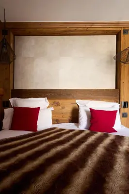 Un ou plusieurs lits dans un hébergement de l'établissement Hôtel Village Montana by Les Etincelles