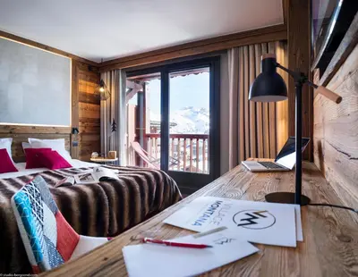 Un ou plusieurs lits dans un hébergement de l'établissement Hôtel Village Montana by Les Etincelles