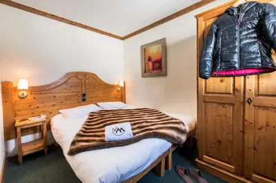 Un ou plusieurs lits dans un hébergement de l'établissement Résidences Village Montana by Les Etincelles