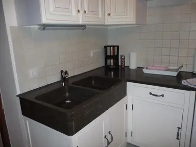 Cuisine ou kitchenette dans l'établissement Le Mazot