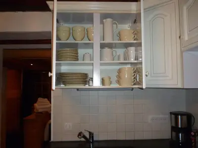 Cuisine ou kitchenette dans l'établissement Le Mazot