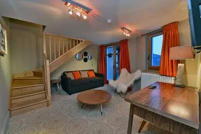 Coin salon dans l'établissement Maison de Famille Les 5 Frères
