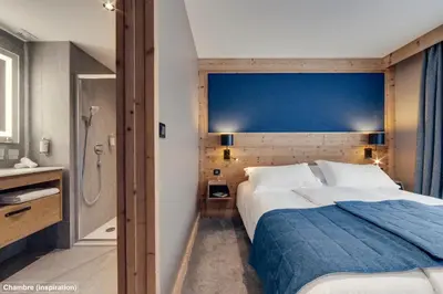 Un ou plusieurs lits dans un hébergement de l'établissement Hôtel Avancher