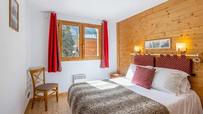 Un ou plusieurs lits dans un hébergement de l'établissement Madame Vacances Résidence Les Jardins de la Vanoise