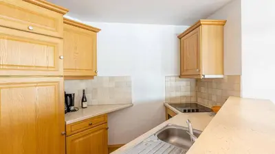 Cuisine ou kitchenette dans l'établissement Madame Vacances Résidence Les Jardins de la Vanoise