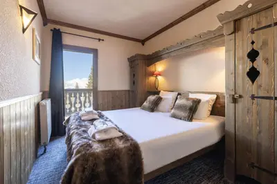 Un ou plusieurs lits dans un hébergement de l'établissement Chalet de l'Ours