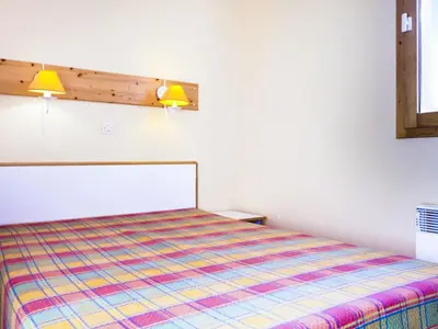 Un ou plusieurs lits dans un hébergement de l'établissement Residence Les Constellations - maeva Home