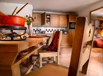 Cuisine ou kitchenette dans l'établissement CGH Résidences & Spas Les Fermes de Ste Foy