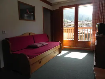 Télévision ou salle de divertissement dans l'établissement Lagrange Vacances Les Valmonts de Val Cenis