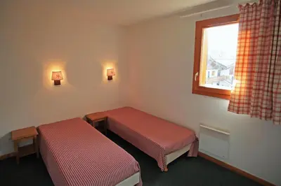 Un ou plusieurs lits dans un hébergement de l'établissement Lagrange Vacances Les Valmonts de Val Cenis