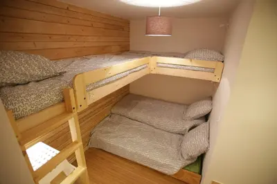 Un ou plusieurs lits dans un hébergement de l'établissement ARC 1800 Appartement 4 pièces Lauzières skis aux pieds