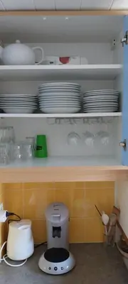 Cuisine ou kitchenette dans l'établissement Duplex Le Vogel