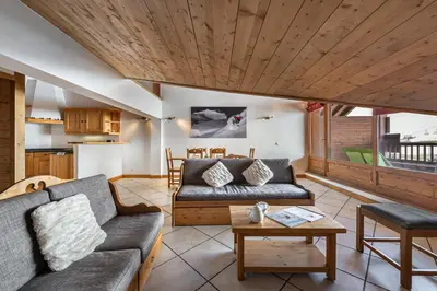 Coin salon dans l'établissement Les Suites du Val Claret by ExplorHome