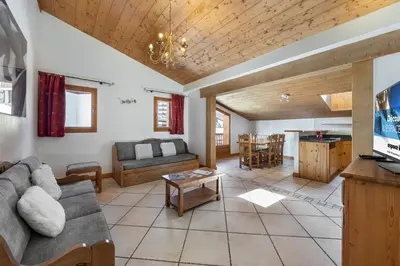 Coin salon dans l'établissement Les Suites du Val Claret by ExplorHome
