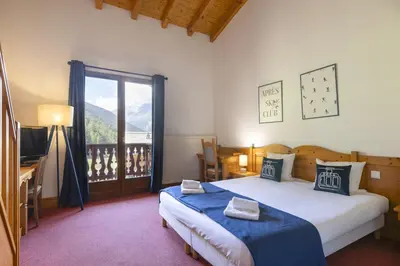 Un ou plusieurs lits dans un hébergement de l'établissement Hôtel Club MMV Le Val Cenis